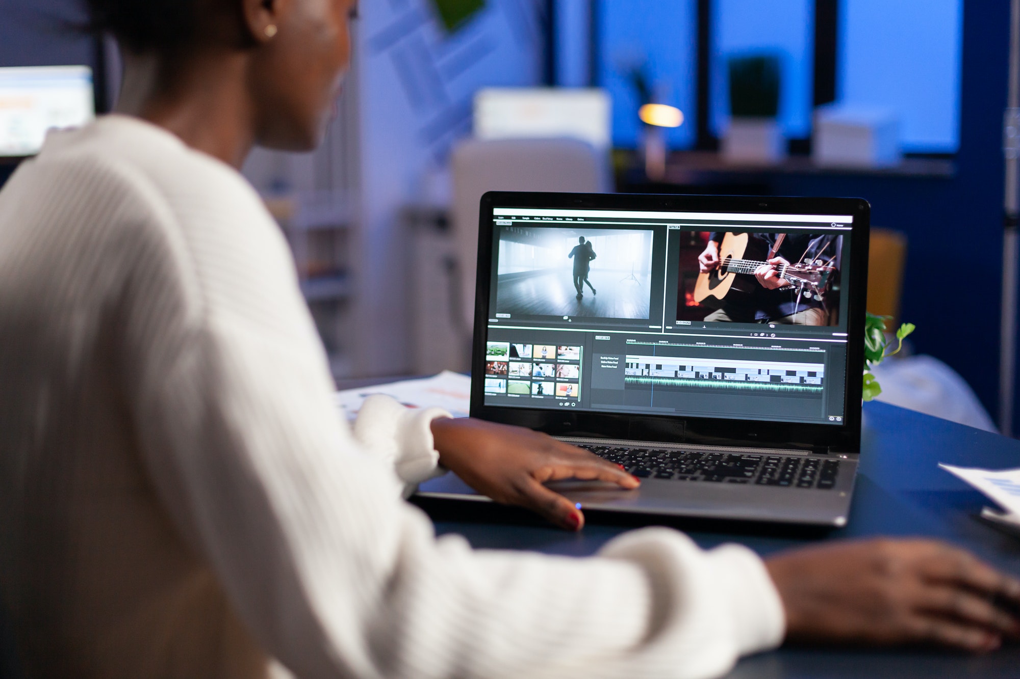black-video-editor-working-overtime-at-new-project-editing-audio-film.jpg